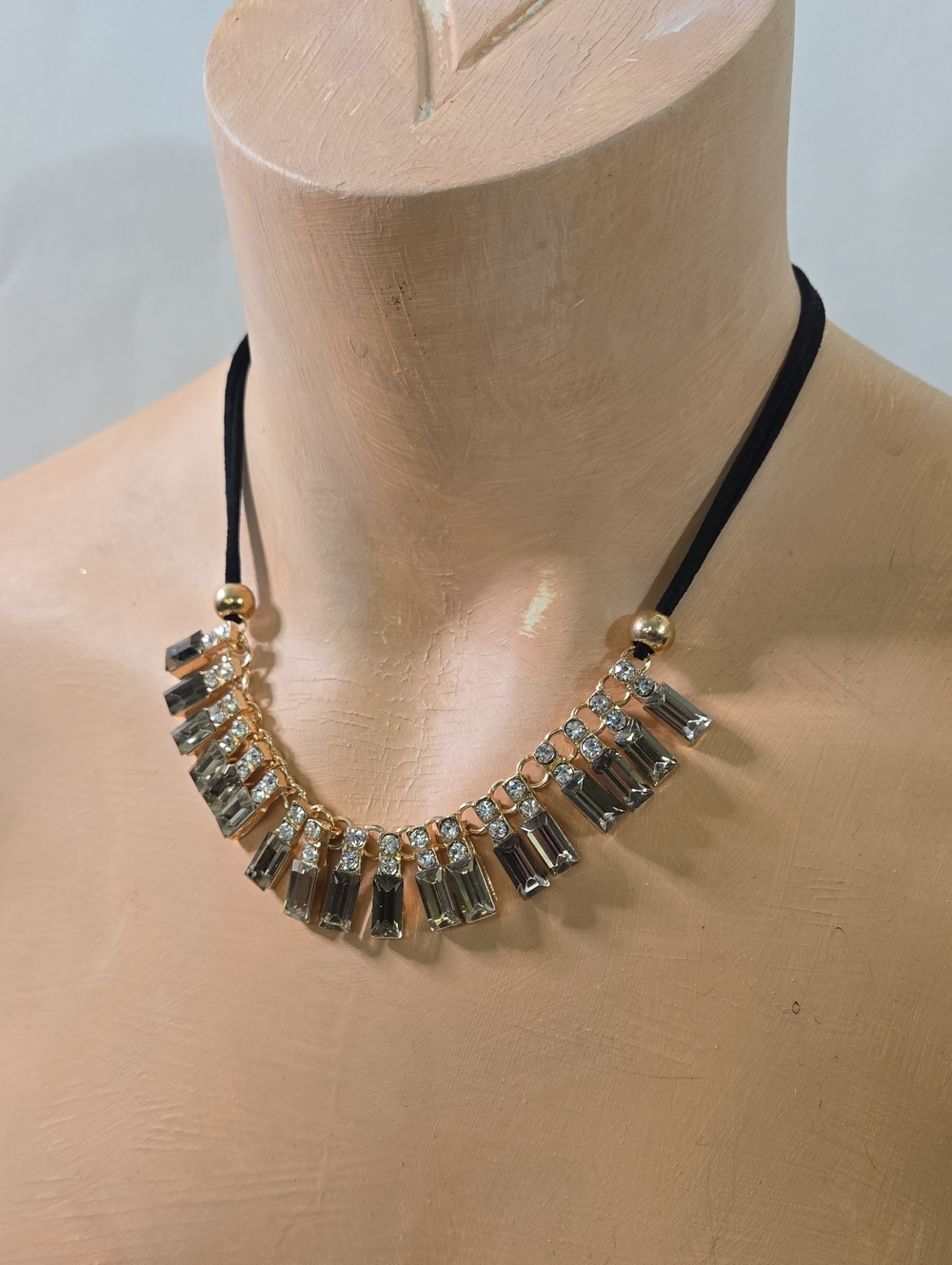 Gold-Tone Necklace with Black Cord and Smoky Crystal Bars